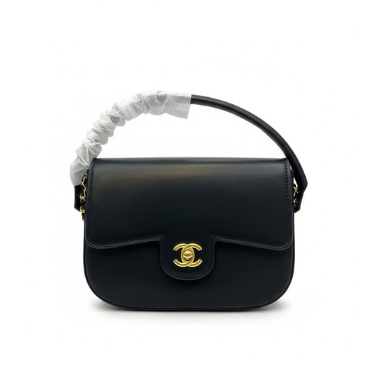 Front view of Chanel Flap Bag on white background.