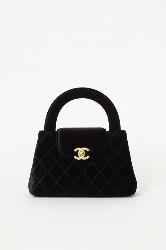 Front view of Chanel Small Kelly Shopper on white background.